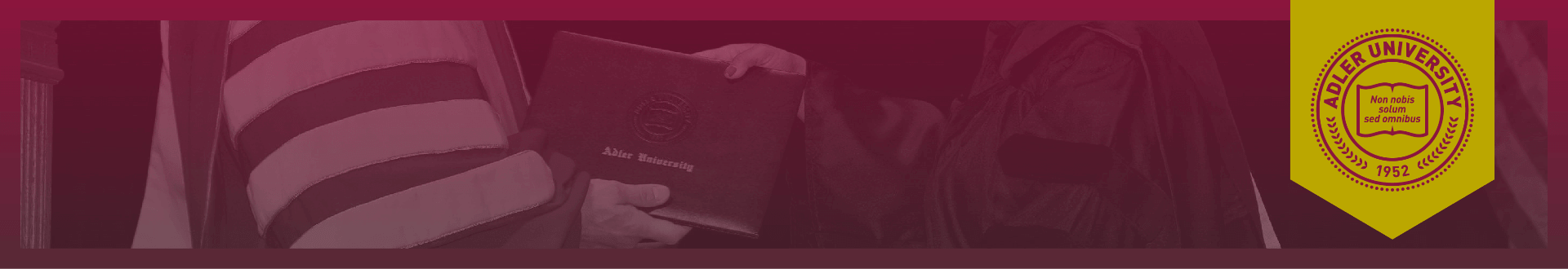 A person in graduation attire receives a diploma from another individual during the Commencement ceremony, with a Millersville University emblem on the right side.